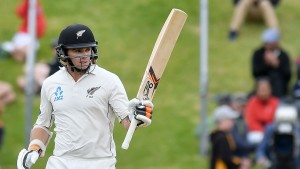 New Zealand's Tom Latham celebrates 50 runs during day three of the first international Test cricket match between New Zealand and Bangladesh at the Basin Reserve in Wellington on January 14, 2017. / AFP / Marty Melville (Photo credit should read MARTY MELVILLE/AFP/Getty Images)