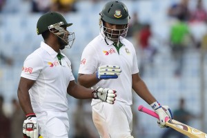 Bangladesh cricketers Tamim Iqbal (R) and Imrul Kayes walk off the field at close of play on the first day of the first Test match between Bangladesh and South Africa at the Zahur Ahmed Chowdhury Stadium in Chittagong on July 21, 2015. AFP PHOTO/ Munir uz ZAMAN (Photo credit should read MUNIR UZ ZAMAN/AFP/Getty Images)